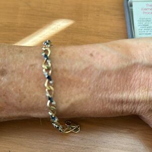 Kremetz sapphire tennis bracelet and two lapel pins with original box